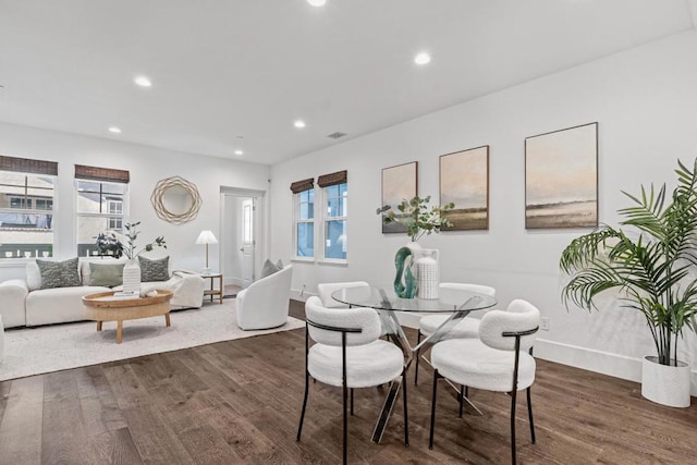 dining room with dark hardwood / wood-style floors