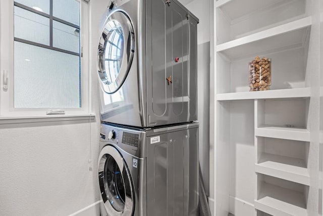 laundry area with stacked washer and dryer