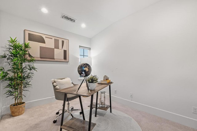 home office featuring vaulted ceiling and light carpet