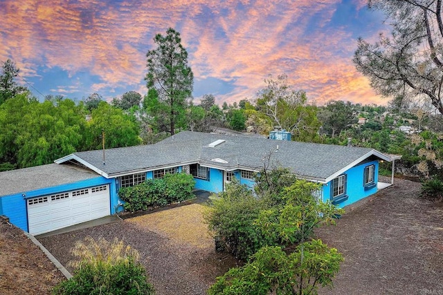 single story home featuring a garage