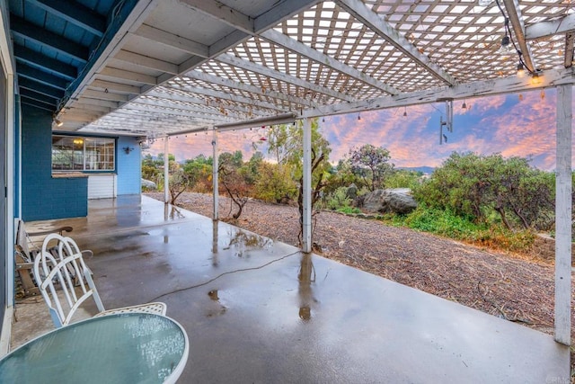 view of patio terrace at dusk