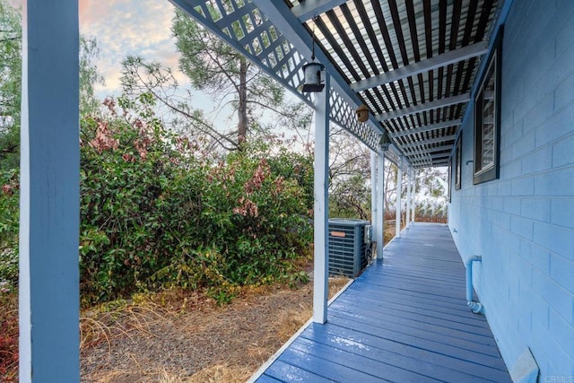 wooden deck featuring central AC unit