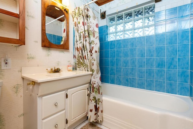 bathroom with shower / tub combo with curtain and vanity