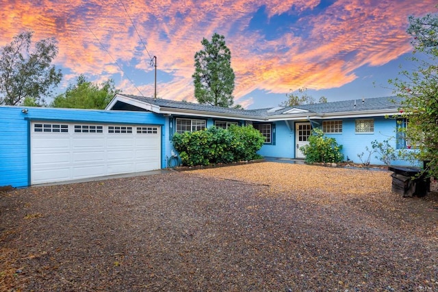 ranch-style house featuring a garage