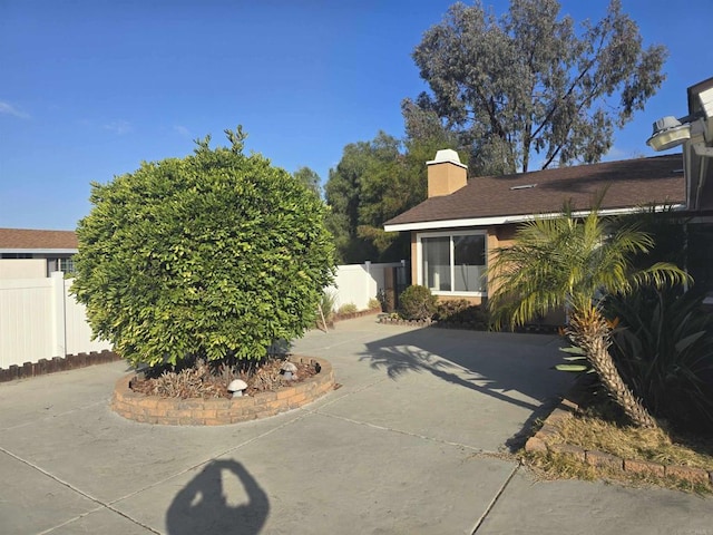 view of property exterior featuring a patio area