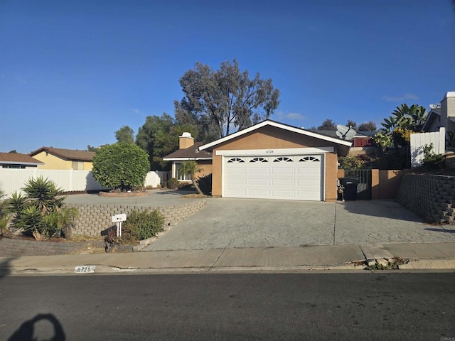 ranch-style house featuring a garage