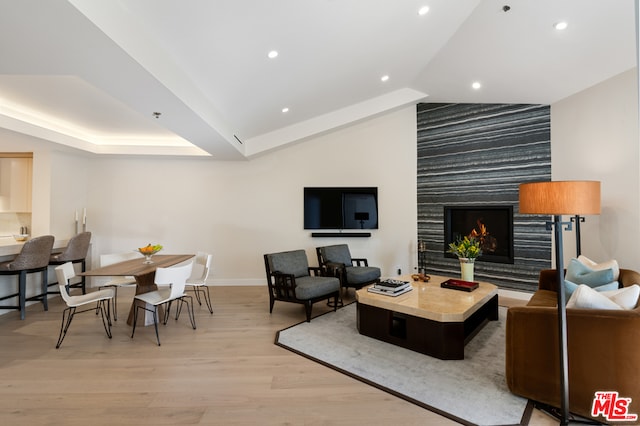 living room featuring a fireplace and light hardwood / wood-style flooring