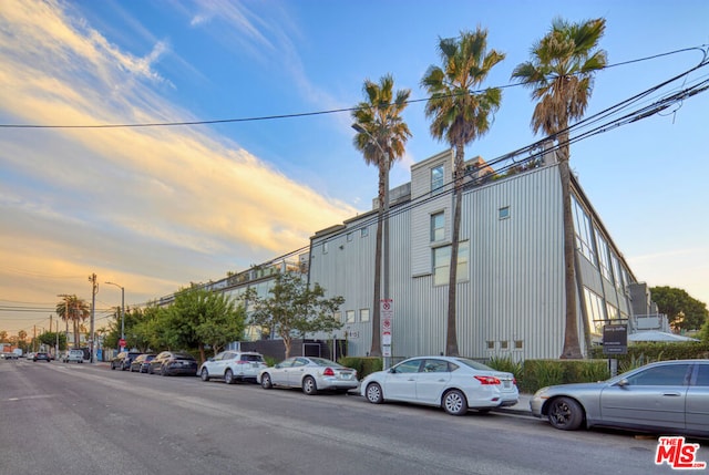 view of outdoor building at dusk