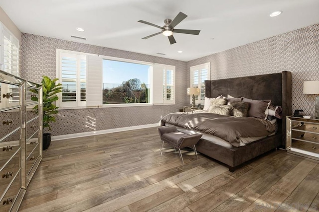 bedroom featuring ceiling fan and dark hardwood / wood-style flooring