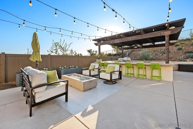 view of patio with an outdoor living space, a pergola, and a bar