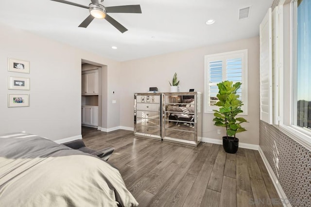 bedroom featuring dark hardwood / wood-style floors and ceiling fan