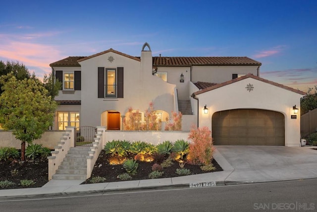 mediterranean / spanish-style house featuring a garage