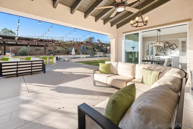 view of patio with an outdoor living space and ceiling fan