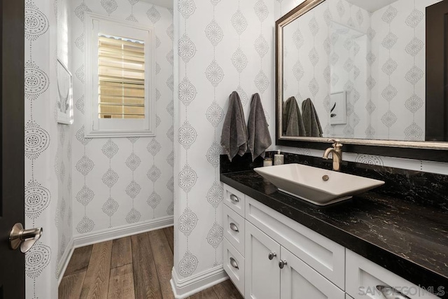 bathroom featuring vanity and hardwood / wood-style floors