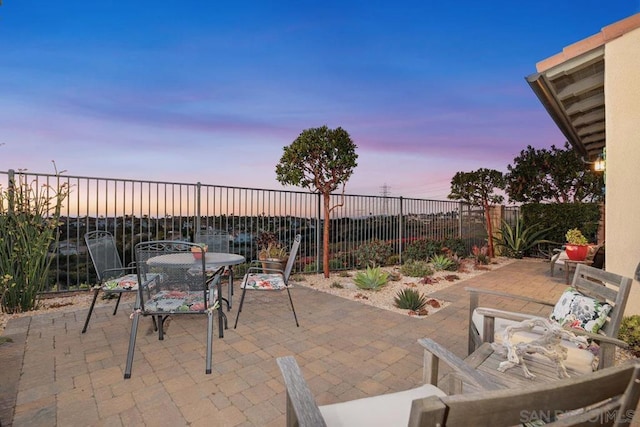 view of patio terrace at dusk