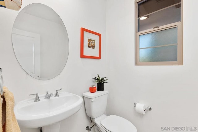 bathroom with toilet and sink