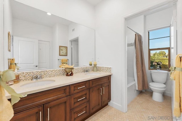 full bathroom with shower / tub combo with curtain, backsplash, vanity, tile patterned floors, and toilet