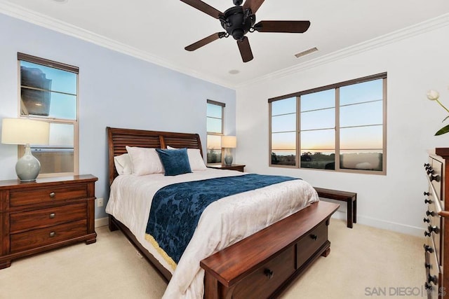 bedroom featuring crown molding, ceiling fan, and light colored carpet