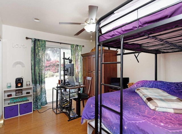 bedroom featuring hardwood / wood-style floors and ceiling fan