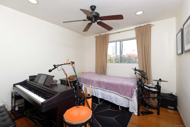 bedroom featuring wood-type flooring and ceiling fan