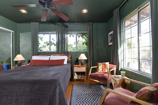 bedroom featuring ceiling fan and wood-type flooring