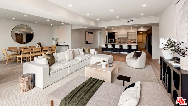 living room with light hardwood / wood-style floors