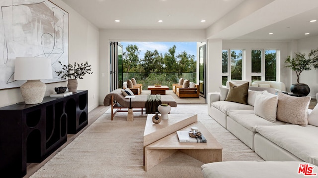 living room featuring plenty of natural light and light hardwood / wood-style floors