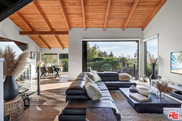 living room with wood ceiling, high vaulted ceiling, and beamed ceiling