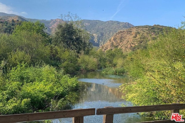 view of mountain feature with a water view