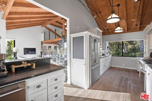 kitchen with white cabinets, hanging light fixtures, wooden ceiling, and beamed ceiling