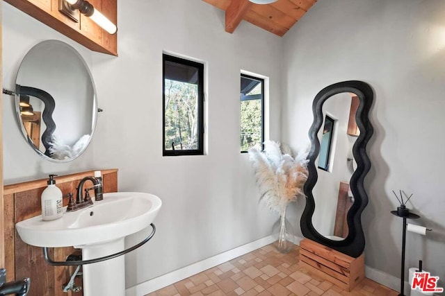 bathroom with lofted ceiling with beams and wooden ceiling