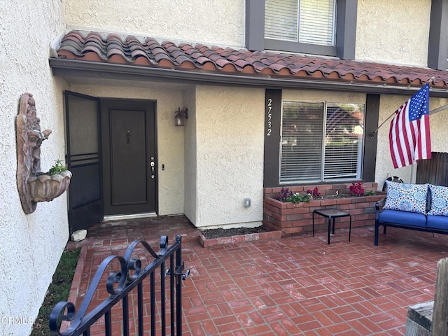 doorway to property featuring a patio area