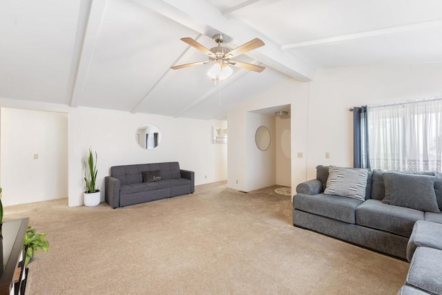 carpeted living room featuring lofted ceiling with beams and ceiling fan