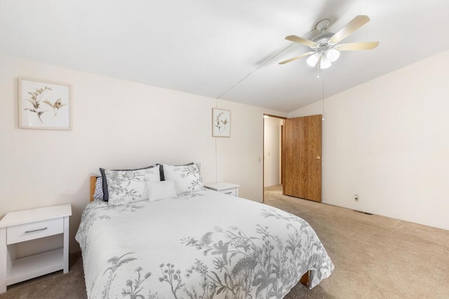 carpeted bedroom featuring vaulted ceiling and ceiling fan