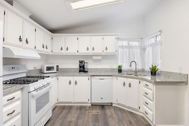 kitchen with sink, white cabinets, and white appliances