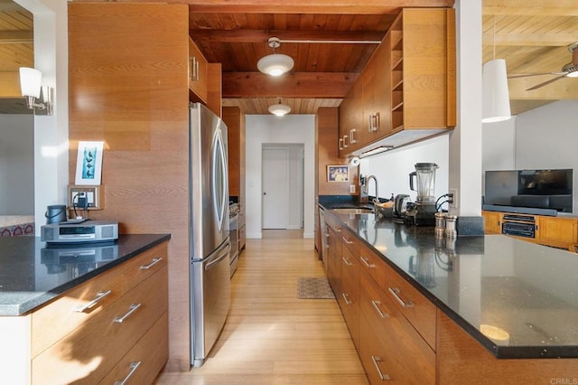 kitchen with sink, stainless steel fridge, wooden ceiling, and beamed ceiling