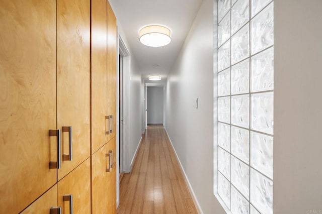 hall with light hardwood / wood-style flooring