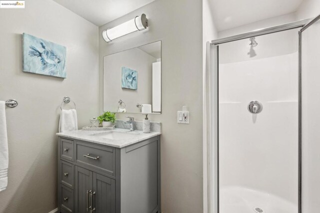 bathroom with vanity and an enclosed shower