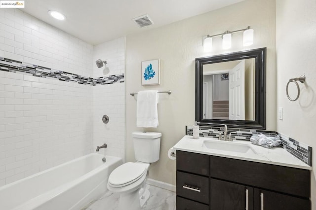 full bathroom with vanity, tiled shower / bath, backsplash, and toilet