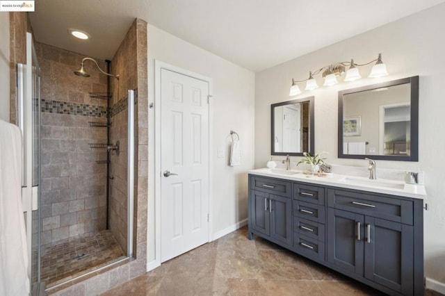 bathroom with vanity and a shower with shower door