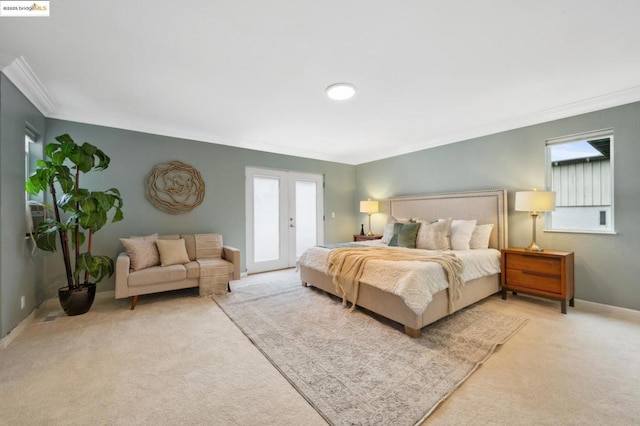 bedroom with light carpet, crown molding, access to outside, and french doors