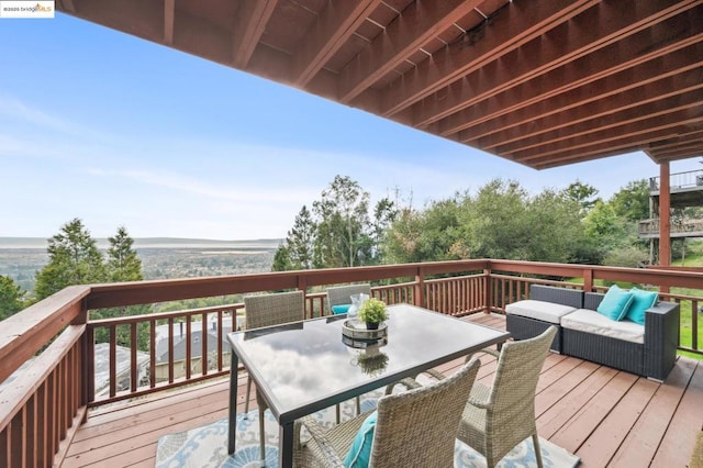 wooden terrace featuring outdoor lounge area