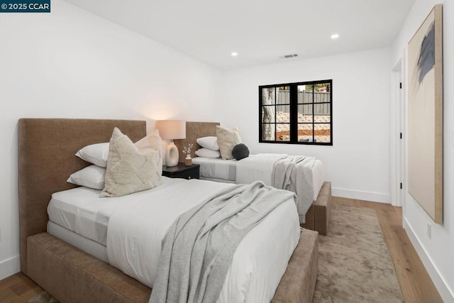 bedroom with light wood-type flooring