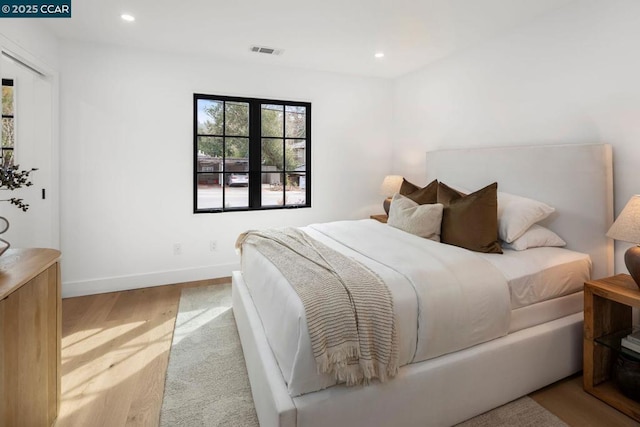 bedroom with light hardwood / wood-style floors