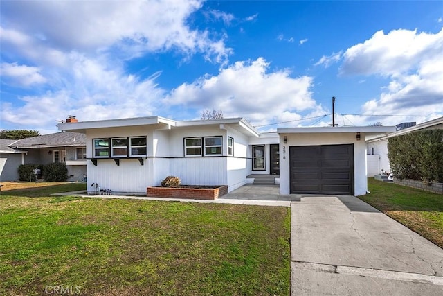 single story home with a garage and a front yard