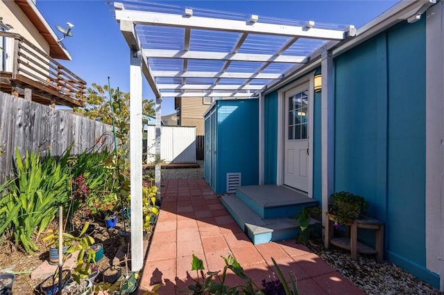 entrance to property with a pergola