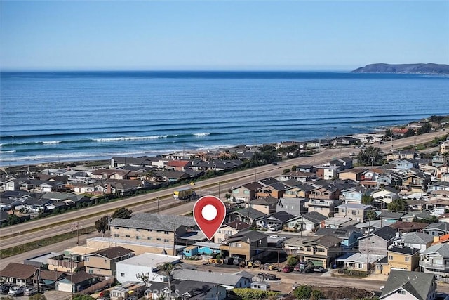 birds eye view of property with a water view and a residential view