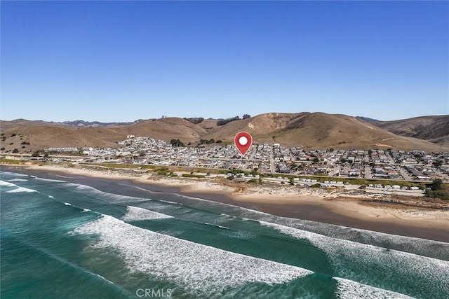 view of mountain feature with a view of the beach