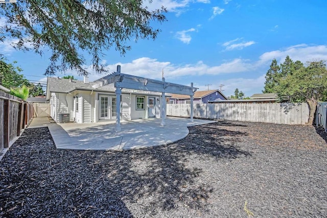 back of property featuring a pergola, a patio, and central air condition unit