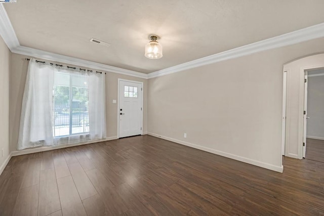 interior space with crown molding and dark wood-type flooring